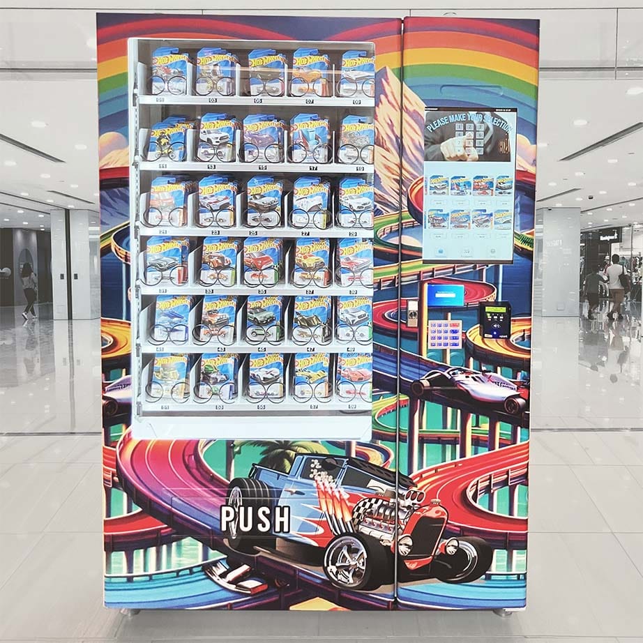 Two people grooming a dog